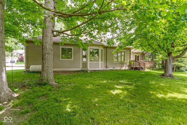 1941 Orchard Ct, Carmel, IN 46280 - back of house with a lawn, a deck, and roof with shingles