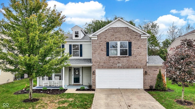 traditional-style home featuring covered porch, concrete driveway, a front yard, and an attached garage