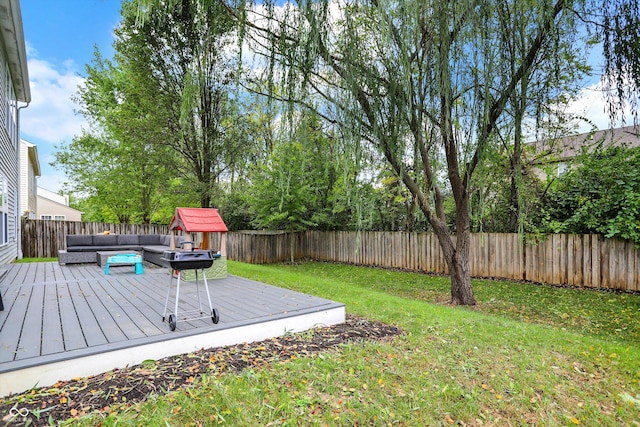 view of yard with an outdoor living space and a wooden deck