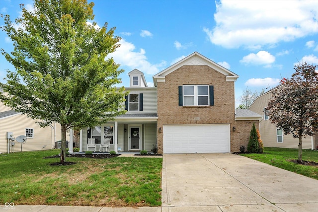 traditional home with an attached garage, a front yard, driveway, covered porch, and brick siding