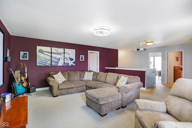 carpeted living room with baseboards and a textured ceiling