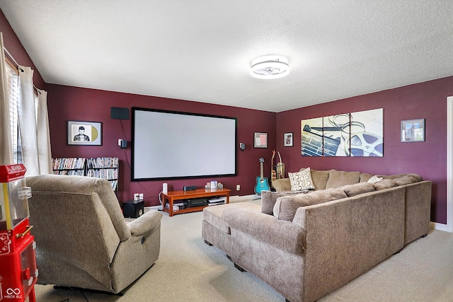 home theater room with carpet, baseboards, and a textured ceiling
