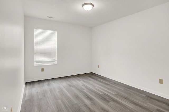 3222 Enclave Ln, Greenwood, IN 46143 - spare room with wood finished floors and baseboards