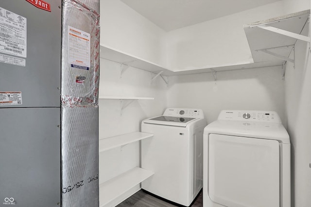 3222 Enclave Ln, Greenwood, IN 46143 - washroom featuring heating unit, washer and dryer, and dark wood finished floors