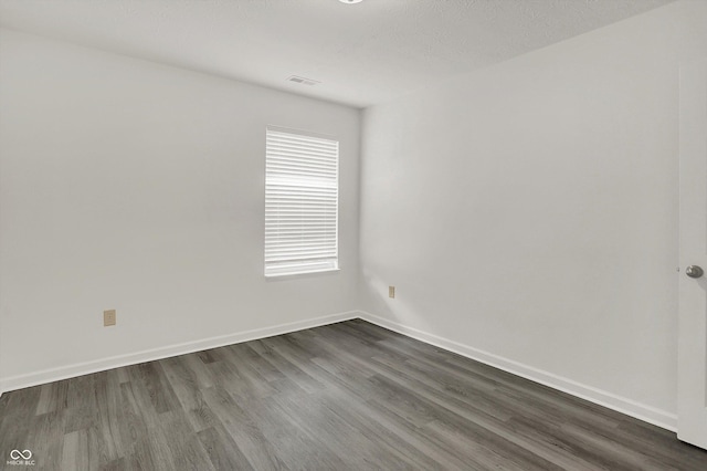 3222 Enclave Ln, Greenwood, IN 46143 - unfurnished room featuring dark wood-type flooring and baseboards