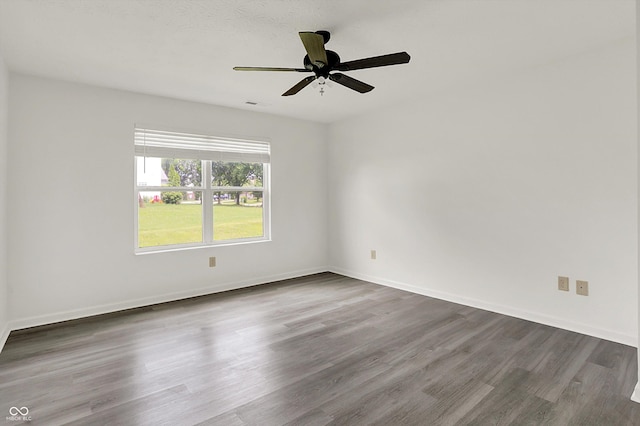 3222 Enclave Ln, Greenwood, IN 46143 - spare room featuring wood finished floors, a ceiling fan, and baseboards