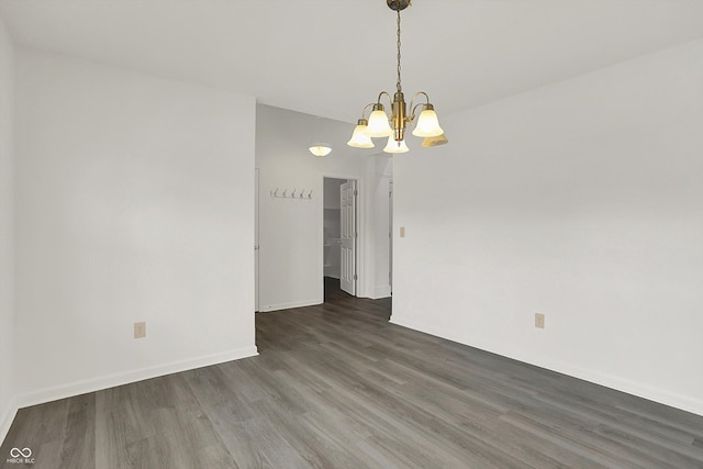 3222 Enclave Ln, Greenwood, IN 46143 - unfurnished room with wood finished floors, a chandelier, and baseboards