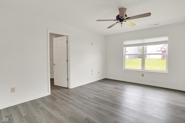 3222 Enclave Ln, Greenwood, IN 46143 - empty room featuring wood finished floors, ceiling fan, and baseboards
