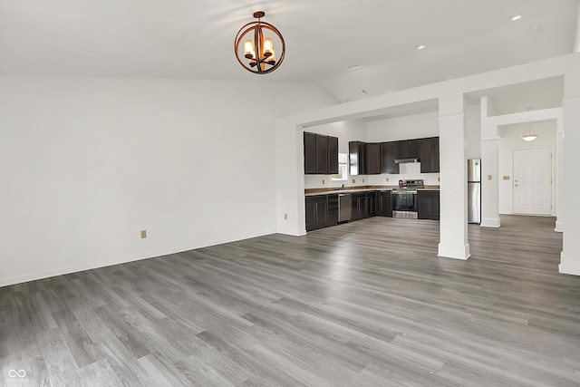 3222 Enclave Ln, Greenwood, IN 46143 - unfurnished living room with a chandelier, light wood-style flooring, baseboards, and high vaulted ceiling