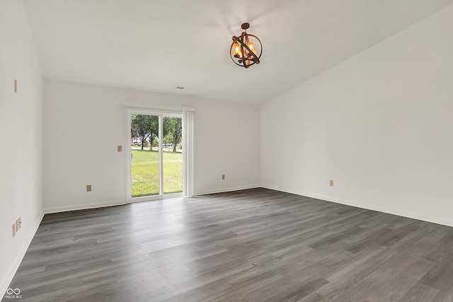 3222 Enclave Ln, Greenwood, IN 46143 - unfurnished room featuring a chandelier, dark wood finished floors, and baseboards