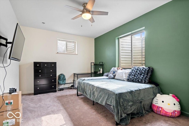 bedroom with multiple windows, carpet floors, and ceiling fan