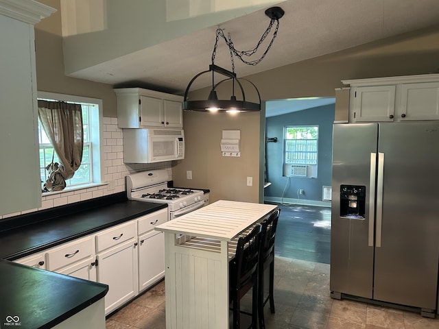 404 Pearl St, Pendleton, IN 46064 - kitchen featuring white appliances, dark countertops, tasteful backsplash, white cabinetry, and baseboards