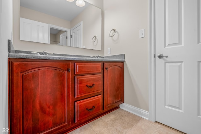 4368 W Eagle Trce, New Palestine, IN 46163 - bathroom with tile patterned flooring, double vanity, and baseboards