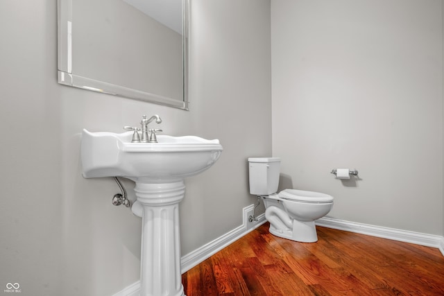 4368 W Eagle Trce, New Palestine, IN 46163 - bathroom featuring baseboards, toilet, and wood finished floors
