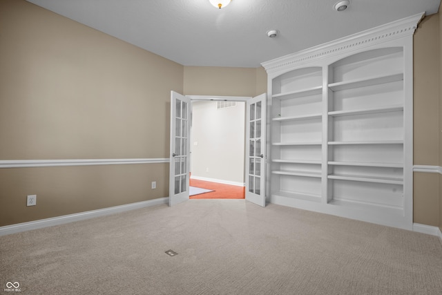 4368 W Eagle Trce, New Palestine, IN 46163 - unfurnished bedroom featuring french doors, carpet flooring, and baseboards