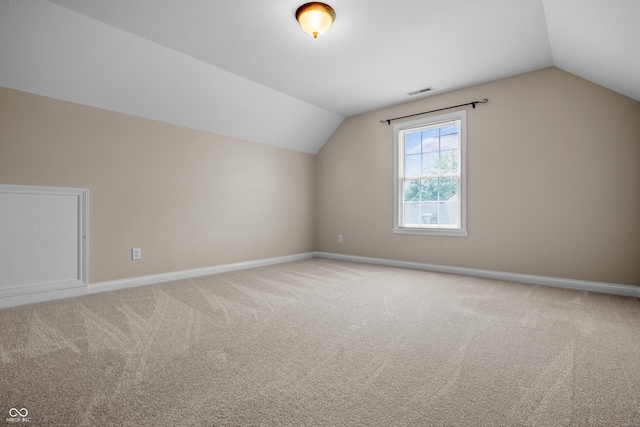 4368 W Eagle Trce, New Palestine, IN 46163 - additional living space with lofted ceiling, baseboards, and carpet floors