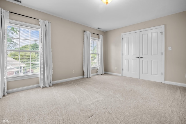 4368 W Eagle Trce, New Palestine, IN 46163 - unfurnished bedroom with baseboards, carpet, and a closet