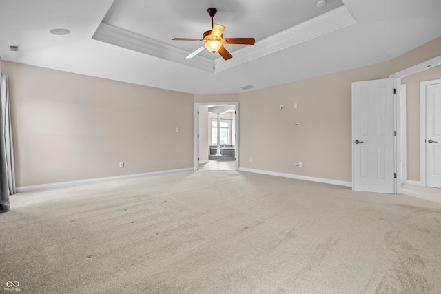 4368 W Eagle Trce, New Palestine, IN 46163 - empty room featuring a tray ceiling, a ceiling fan, light carpet, and ornamental molding