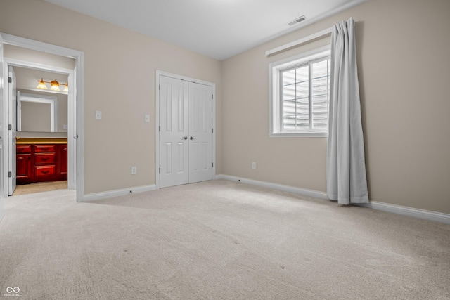 4368 W Eagle Trce, New Palestine, IN 46163 - unfurnished bedroom with light carpet, baseboards, and a closet