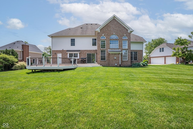 4368 W Eagle Trce, New Palestine, IN 46163 - back of house featuring brick siding, a wooden deck, a lawn, and a garage