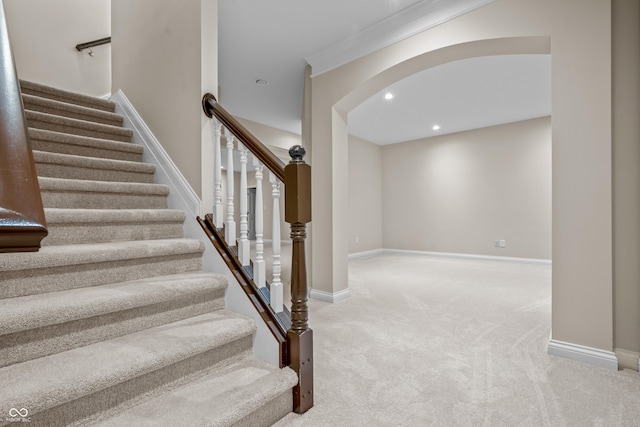 4368 W Eagle Trce, New Palestine, IN 46163 - stairs featuring carpet floors, arched walkways, baseboards, recessed lighting, and crown molding
