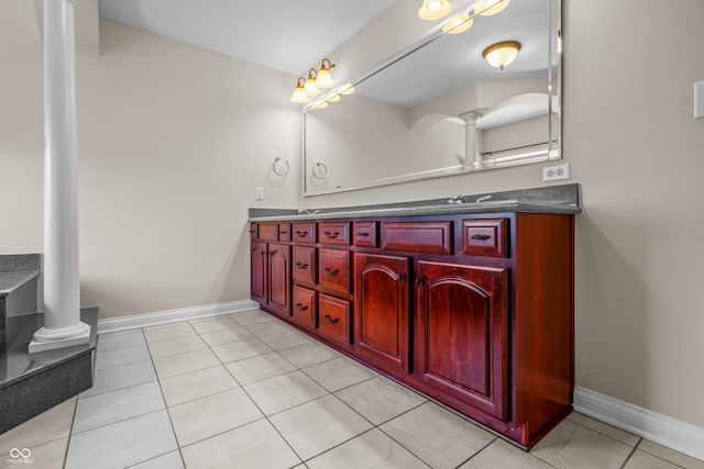 4368 W Eagle Trce, New Palestine, IN 46163 - full bathroom with double vanity, ornate columns, baseboards, and tile patterned flooring