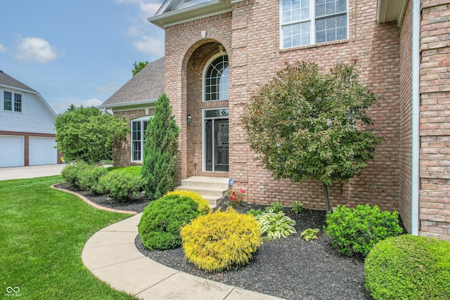 4368 W Eagle Trce, New Palestine, IN 46163 - view of exterior entry with brick siding and a lawn
