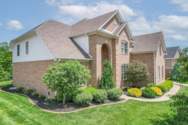 4368 W Eagle Trce, New Palestine, IN 46163 - view of front facade with a shingled roof, brick siding, and a front lawn