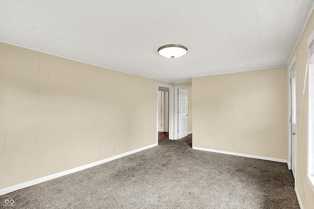 425 Aiken St, Hope, IN 47246 - spare room featuring dark colored carpet and baseboards
