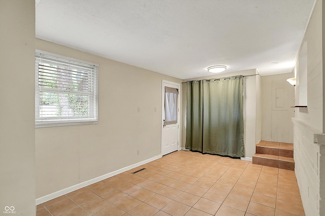 425 Aiken St, Hope, IN 47246 - empty room featuring light tile patterned floors and baseboards