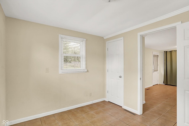 425 Aiken St, Hope, IN 47246 - unfurnished bedroom featuring light tile patterned floors and ornamental molding