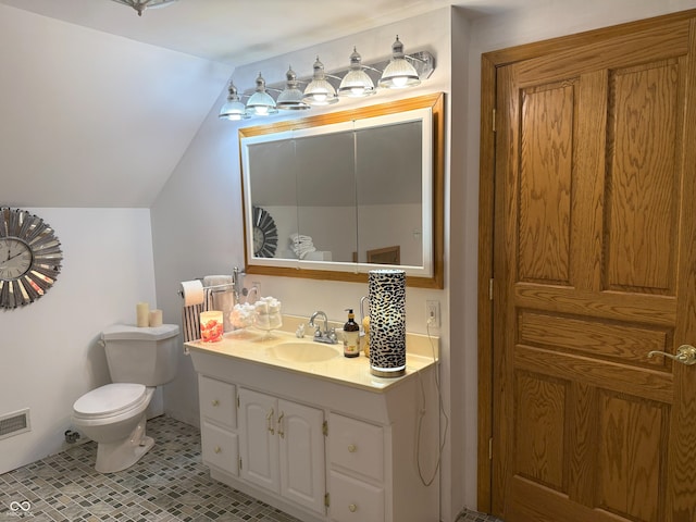 4600 S Tahoe Trl, Crawfordsville, IN 47933 - bathroom with toilet, lofted ceiling, vanity, and tile patterned flooring