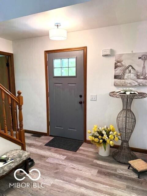 4600 S Tahoe Trl, Crawfordsville, IN 47933 - foyer with baseboards, wood finished floors, and stairs
