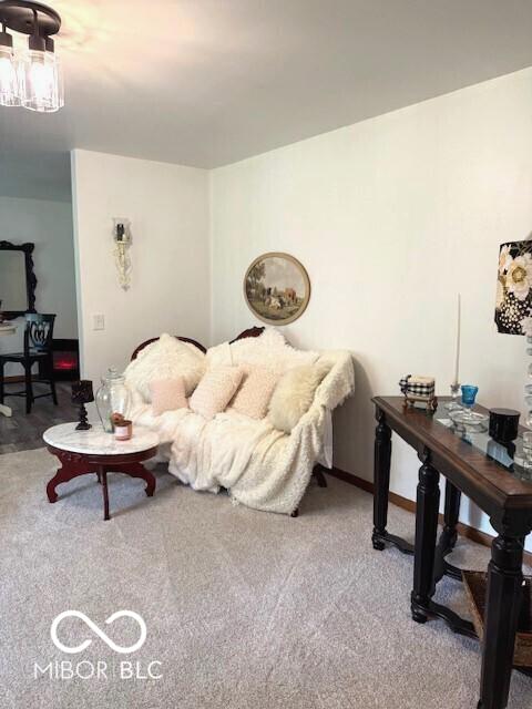 4600 S Tahoe Trl, Crawfordsville, IN 47933 - carpeted living area with a chandelier