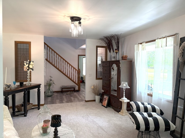4600 S Tahoe Trl, Crawfordsville, IN 47933 - carpeted living room featuring stairway and baseboards