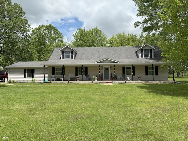4600 S Tahoe Trl, Crawfordsville, IN 47933 - cape cod-style house featuring a porch, a front yard, and a shingled roof