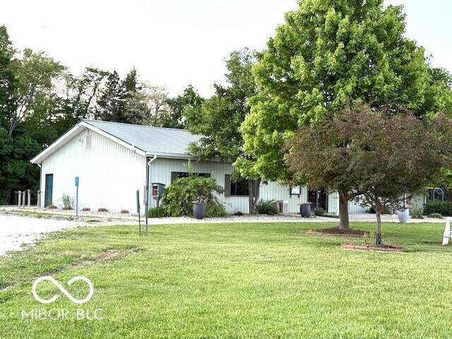 4600 S Tahoe Trl, Crawfordsville, IN 47933 - view of front facade with a front yard and metal roof