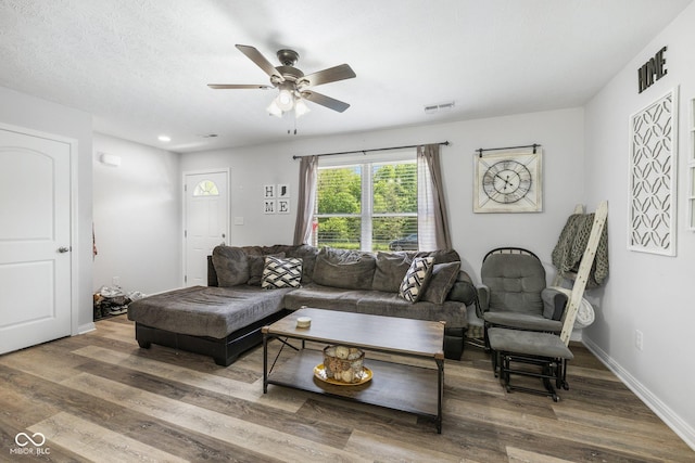 508 Jefferson, Coatesville, IN 46121 - living area featuring ceiling fan, wood finished floors, and baseboards
