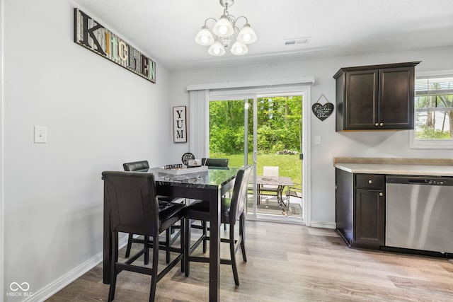 508 Jefferson, Coatesville, IN 46121 - dining room with baseboards, light wood-style flooring, and a chandelier