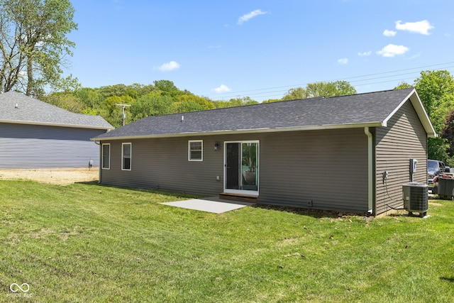 508 Jefferson, Coatesville, IN 46121 - rear view of house featuring central air condition unit, a lawn, and a shingled roof