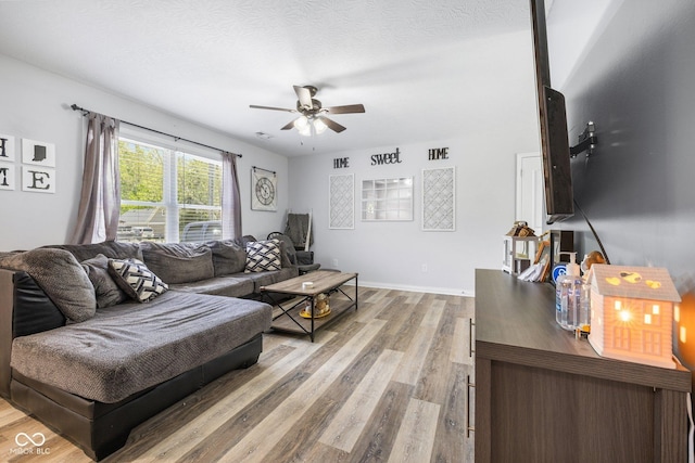 508 Jefferson, Coatesville, IN 46121 - living area with light wood finished floors, ceiling fan, and baseboards