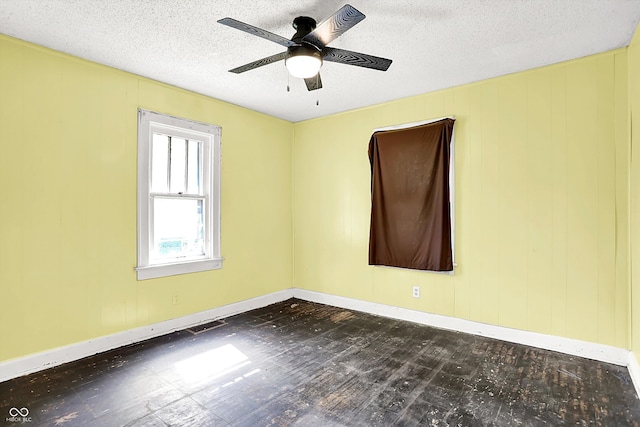 1523 E Mills Ave, Indianapolis, IN 46227 - empty room with ceiling fan, a textured ceiling, and baseboards