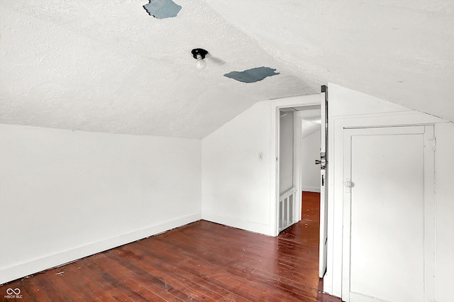 1523 E Mills Ave, Indianapolis, IN 46227 - bonus room with a textured ceiling, wood-type flooring, lofted ceiling, and baseboards