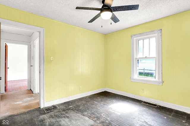 1523 E Mills Ave, Indianapolis, IN 46227 - unfurnished room featuring a ceiling fan, baseboards, hardwood / wood-style floors, and a textured ceiling