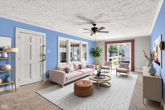 1523 E Mills Ave, Indianapolis, IN 46227 - living room featuring ornamental molding, a ceiling fan, and a textured ceiling