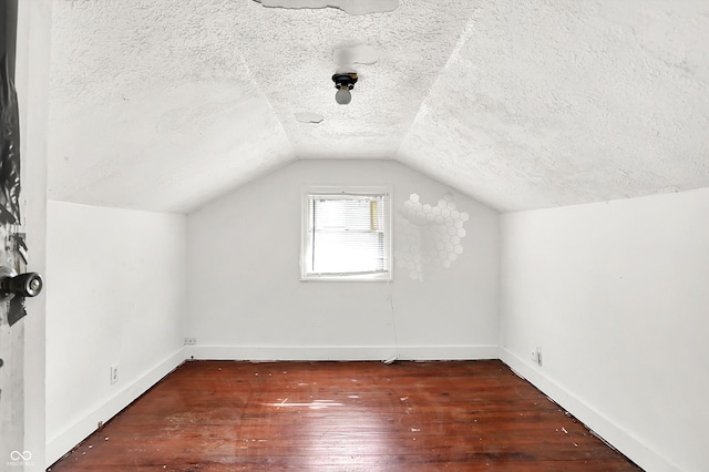1523 E Mills Ave, Indianapolis, IN 46227 - bonus room featuring wood-type flooring, a textured ceiling, and lofted ceiling