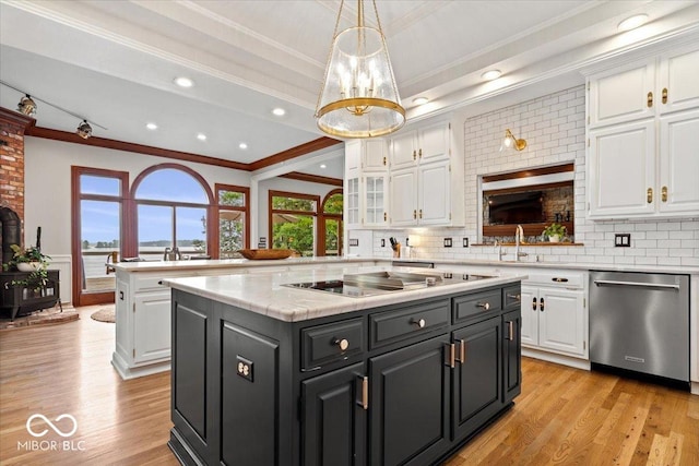 11715 Landings Dr, Indianapolis, IN 46256 - kitchen with stainless steel dishwasher, ornamental molding, white cabinetry, light countertops, and a kitchen island