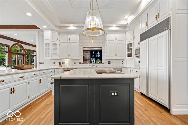 11715 Landings Dr, Indianapolis, IN 46256 - kitchen with white cabinets, light wood finished floors, ornamental molding, and recessed lighting
