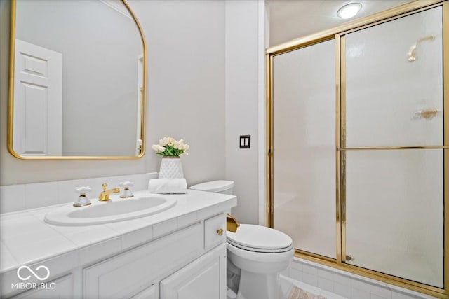 11715 Landings Dr, Indianapolis, IN 46256 - bathroom featuring vanity, toilet, and a stall shower