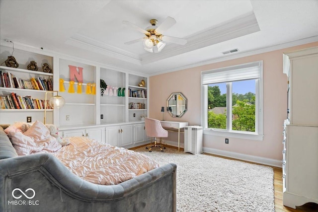 11715 Landings Dr, Indianapolis, IN 46256 - bedroom featuring a raised ceiling, ornamental molding, light wood-style floors, baseboards, and a ceiling fan